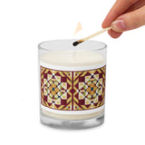 A person lighting a sleek glass jar soy candle with a country farmhouse barn quilted pattern design of Autumn Season color scheme. 