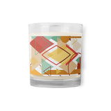 A glass  jar candle decorated with a Southwest theme abstract illustration with geometric shapes and calming pastel colors