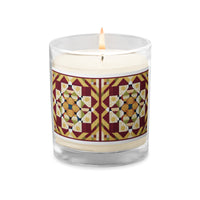 A lighted sleek glass jar soy candle with a country farmhouse barn quilted pattern design of Autumn Season color scheme. 