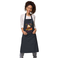 Eco-friendly organic cotton apron printed with pumpkin spice coffee cup design on the front and with a funny earth saving message reading "Save the Earth, it's the only planet with pumpkin spice coffee"