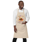 Eco-friendly organic cotton apron printed with pumpkin spice coffee cup design on the front and with a funny earth saving message reading "Save the Earth, it's the only planet with pumpkin spice coffee"